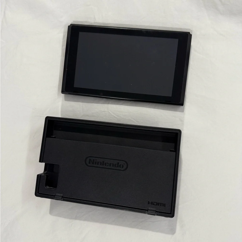 Nintendo Switch with Gray, Purple, and Orange Joy-Con Controllers
